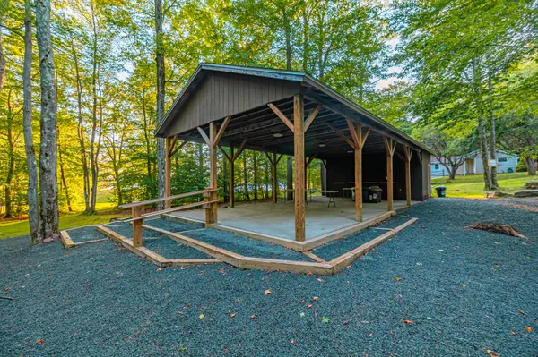 a view of a swimming pool with a yard