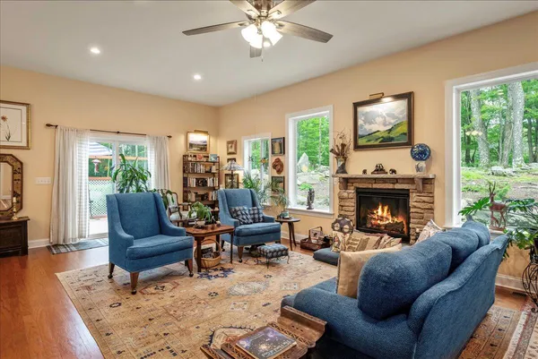 a living room with furniture and a fireplace