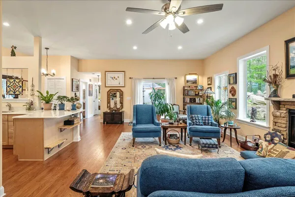 a living room with furniture and a large window