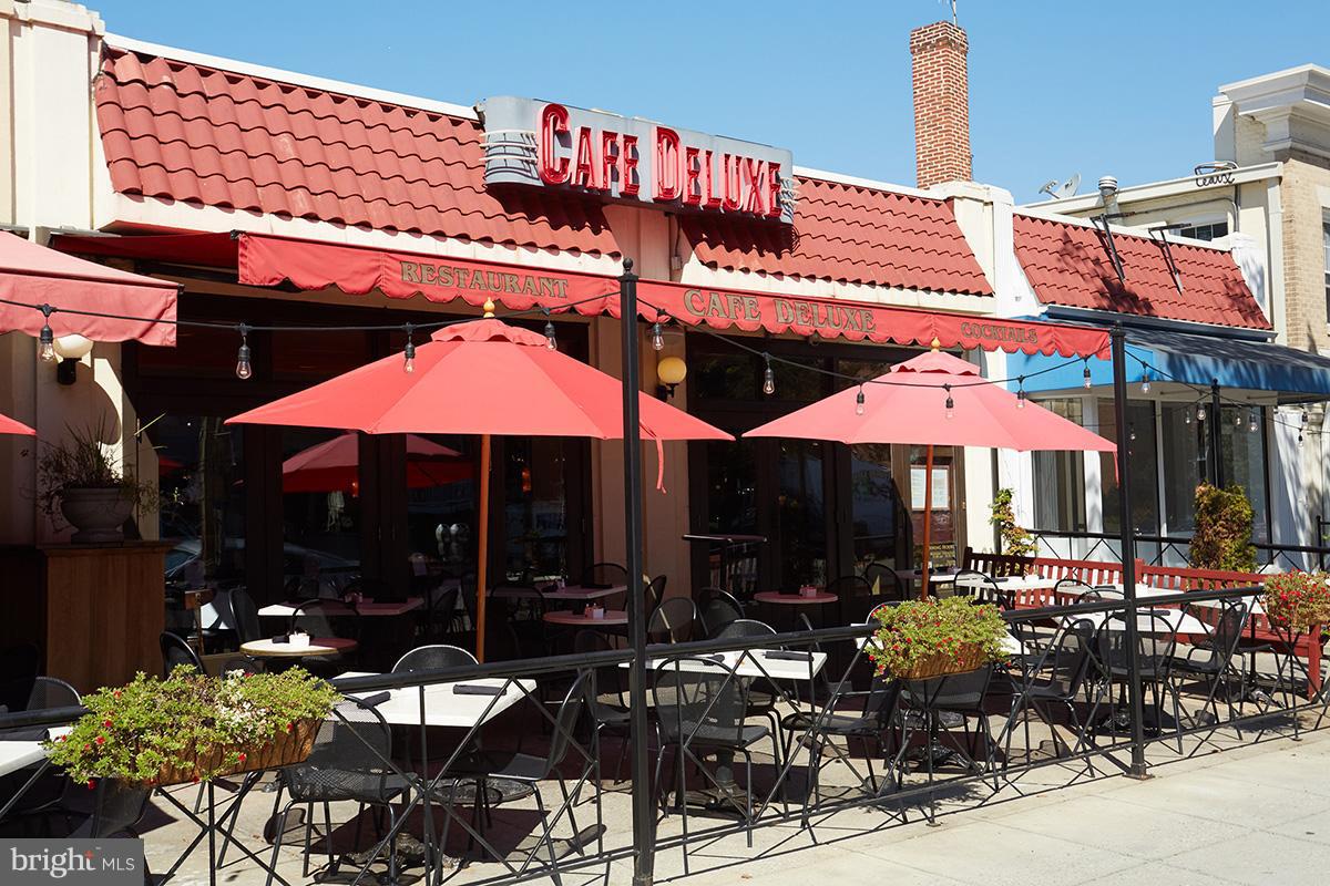 4004 Beecher Street Northwest, Unit 102 Washington, DC 20007 - Photo 17 of 24 a view of a cafe with sitting area