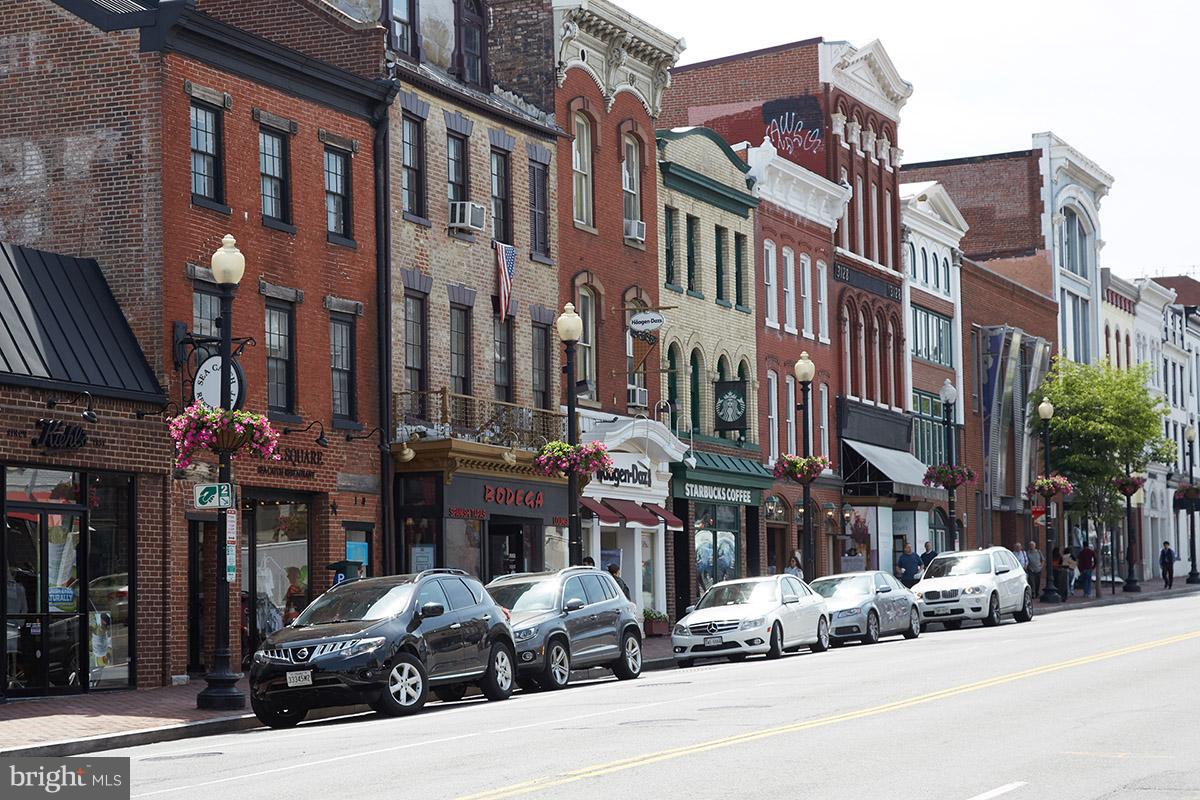 4004 Beecher Street Northwest, Unit 102 Washington, DC 20007 - Photo 23 of 24 a street view of a building and a street