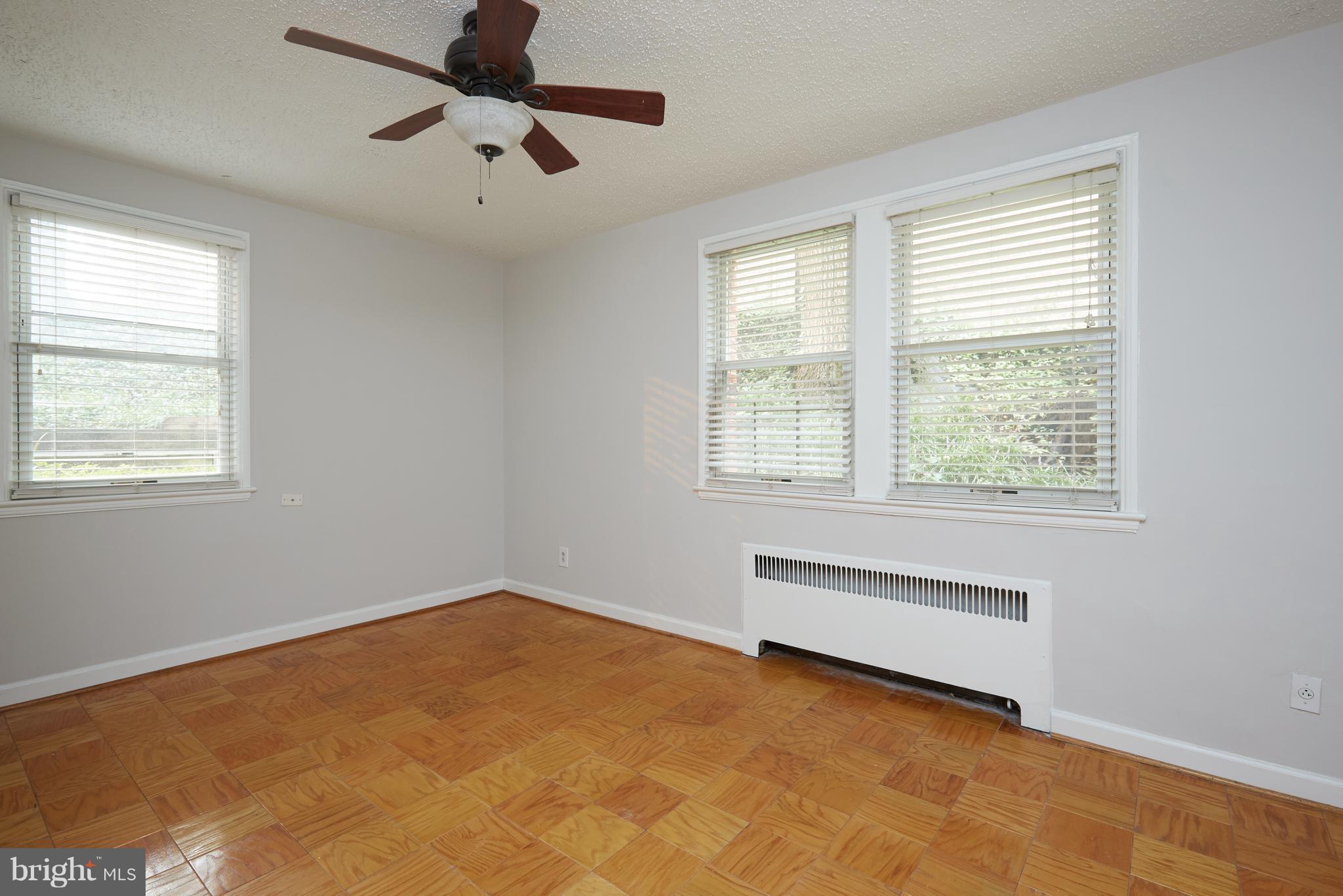 4004 Beecher Street Northwest, Unit 102 Washington, DC 20007 - Photo 9 of 24 a view of an empty room with a window