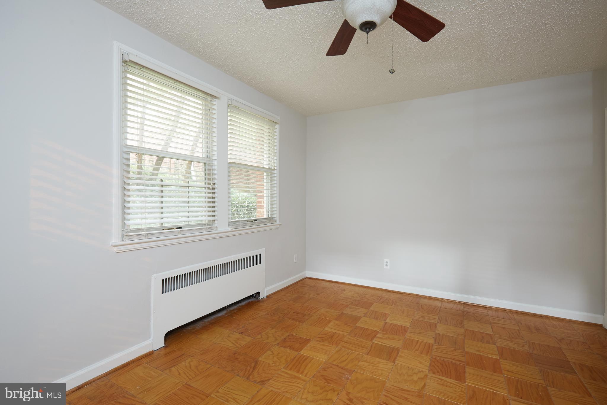 4004 Beecher Street Northwest, Unit 102 Washington, DC 20007 - Photo 10 of 24 a view of an empty room with a window