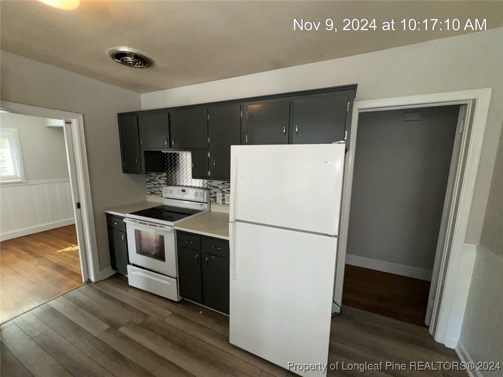 1429 Pine Valley Loop Fayetteville, NC 28305 - Photo 14 of 27 a white refrigerator freezer sitting inside of a kitchen
