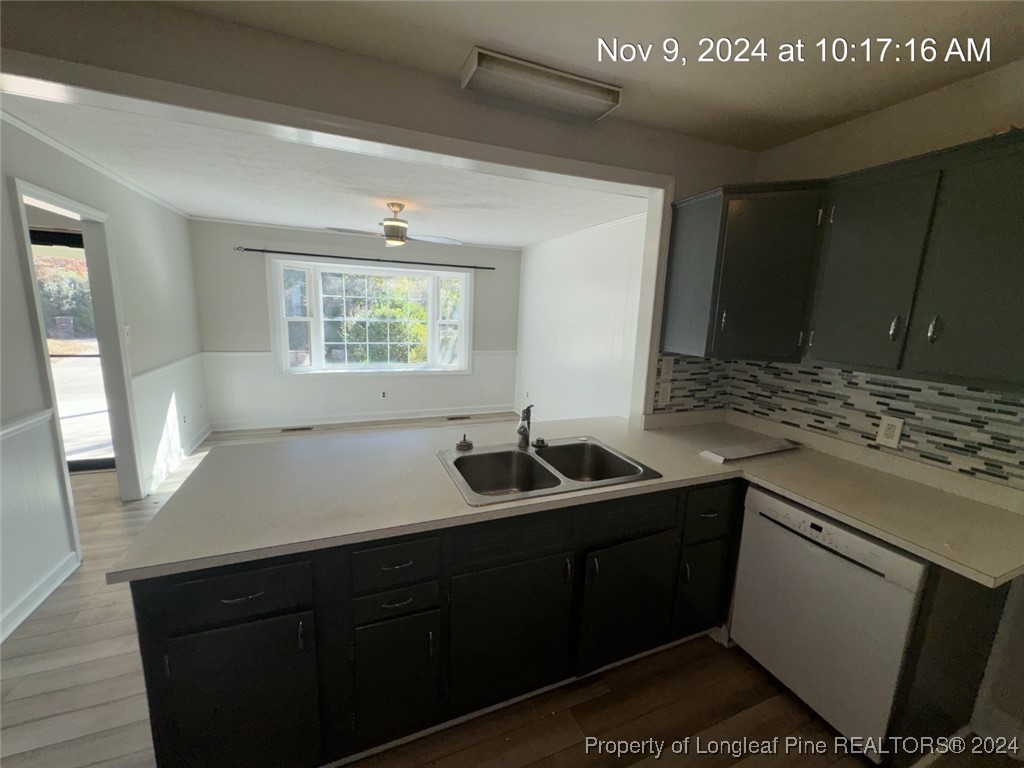 1429 Pine Valley Loop Fayetteville, NC 28305 - Photo 15 of 27 a kitchen with a sink and cabinets