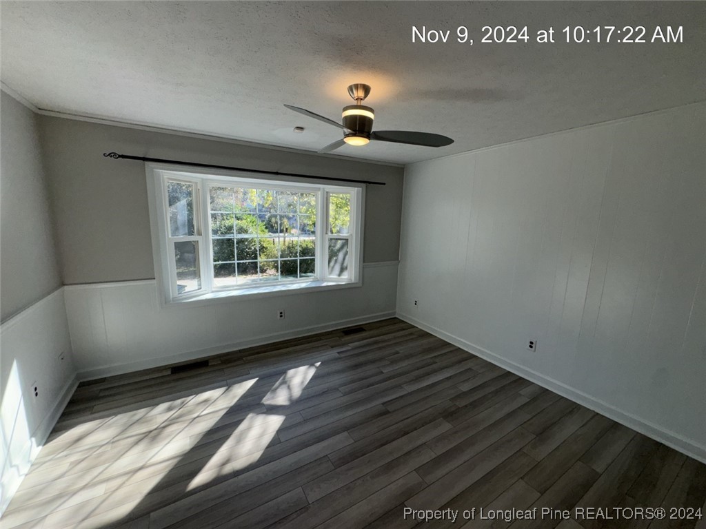 1429 Pine Valley Loop Fayetteville, NC 28305 - Photo 16 of 27 a view of an empty room with wooden floor and a window