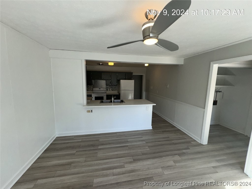 1429 Pine Valley Loop Fayetteville, NC 28305 - Photo 17 of 27 a view of a kitchen cabinets and wooden floor