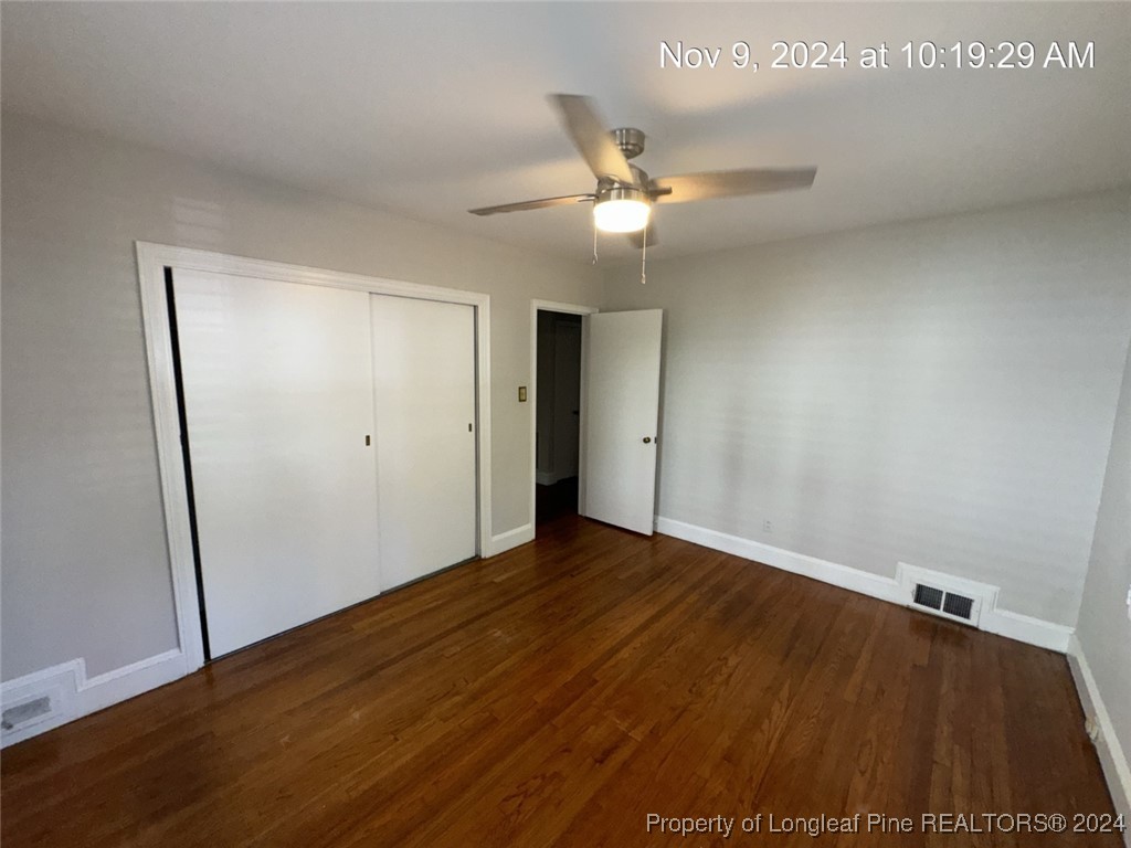 1429 Pine Valley Loop Fayetteville, NC 28305 - Photo 21 of 27 an empty room with wooden floor and ceiling fan