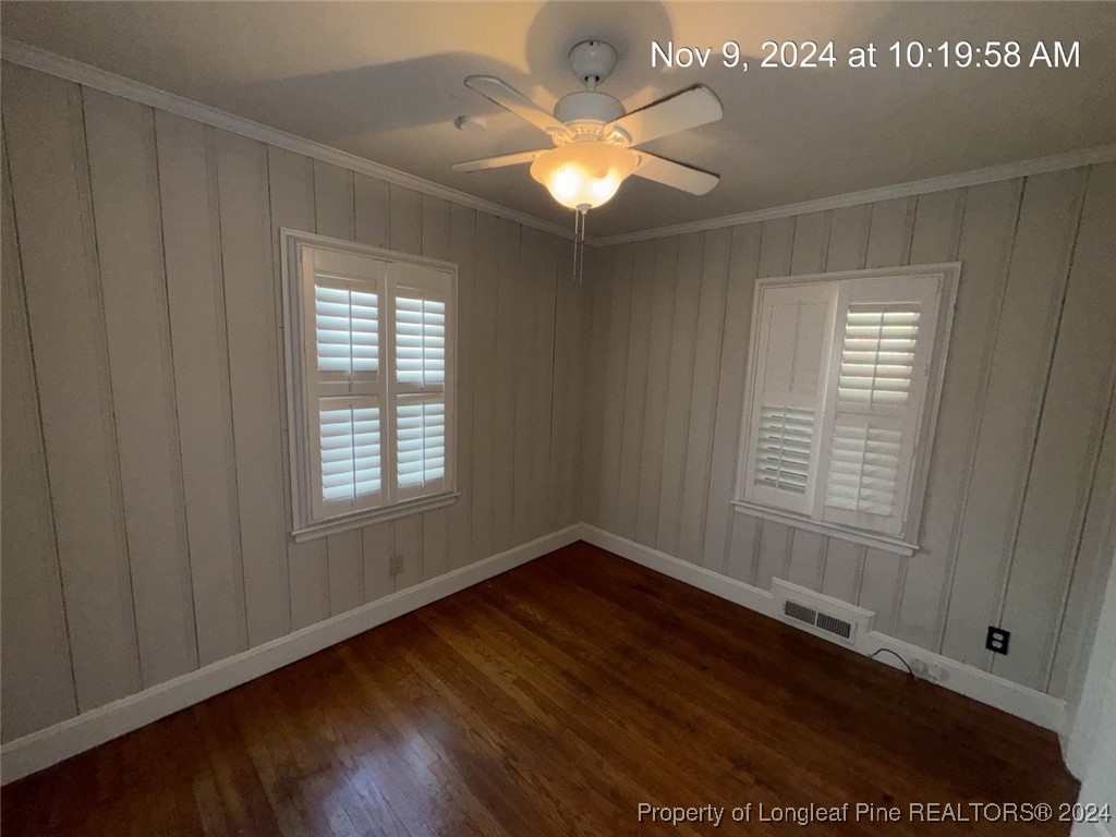 1429 Pine Valley Loop Fayetteville, NC 28305 - Photo 24 of 27 a view of an empty room with wooden floor and a window