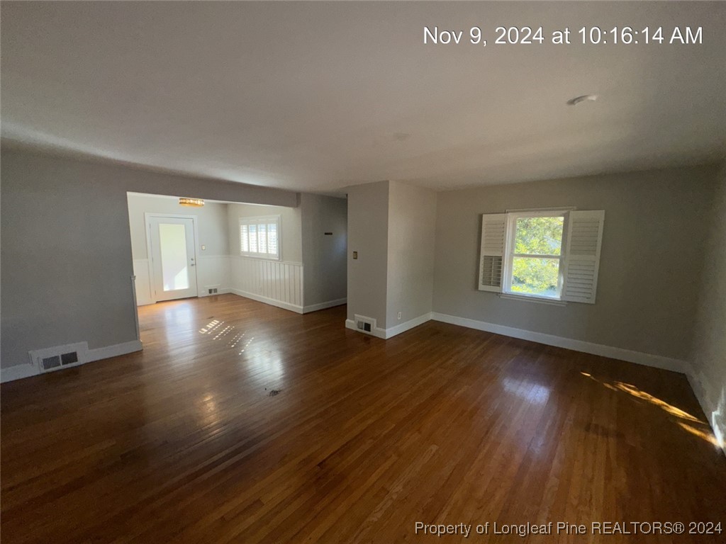 1429 Pine Valley Loop Fayetteville, NC 28305 - Photo 10 of 27 an empty room with wooden floor and windows