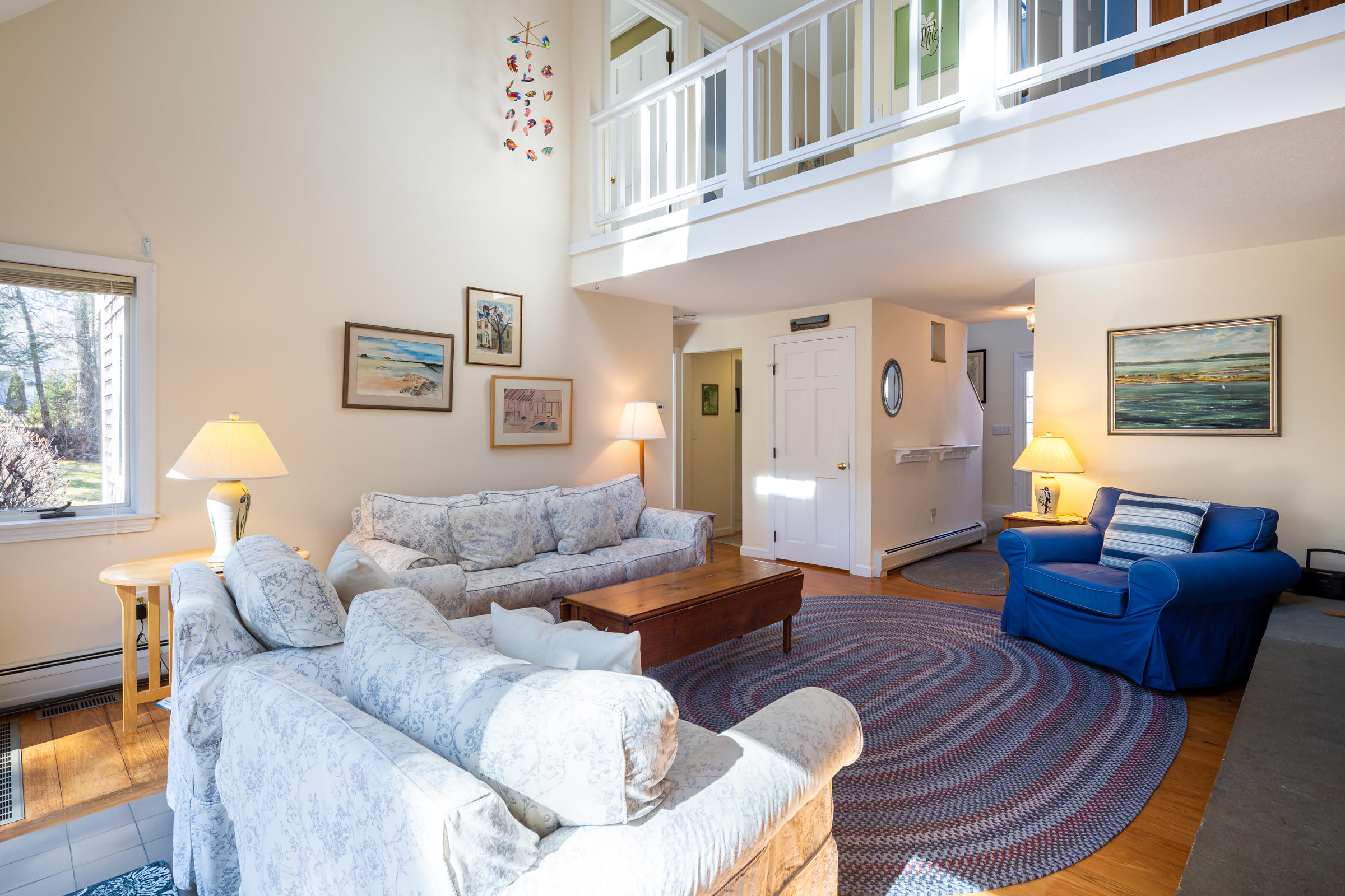 40 Chestnut Drive Orleans, MA 02653 - Photo 11 of 40 a living room with furniture and a large window