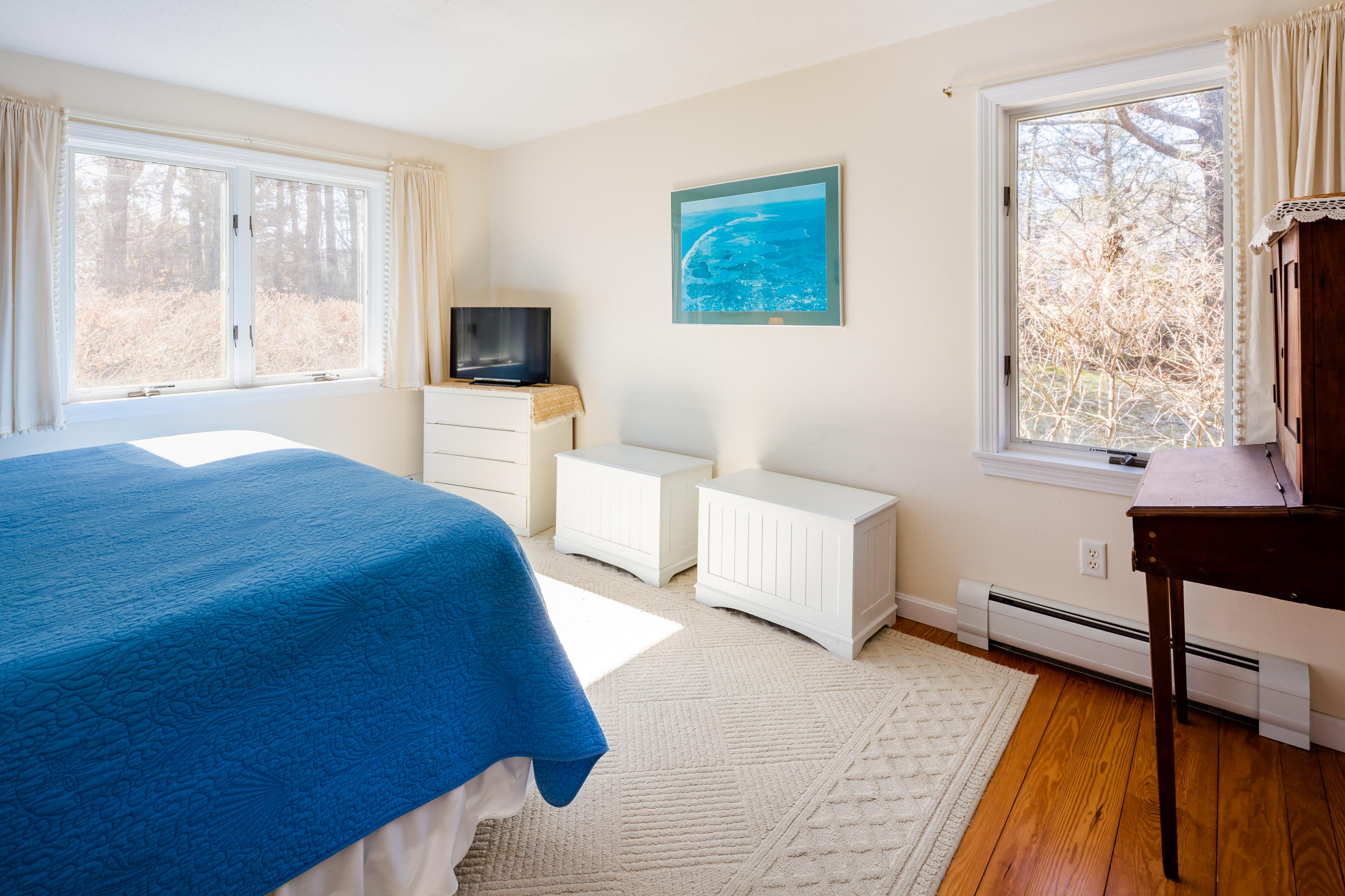 40 Chestnut Drive Orleans, MA 02653 - Photo 17 of 40 a bedroom with a bed and a flat screen tv