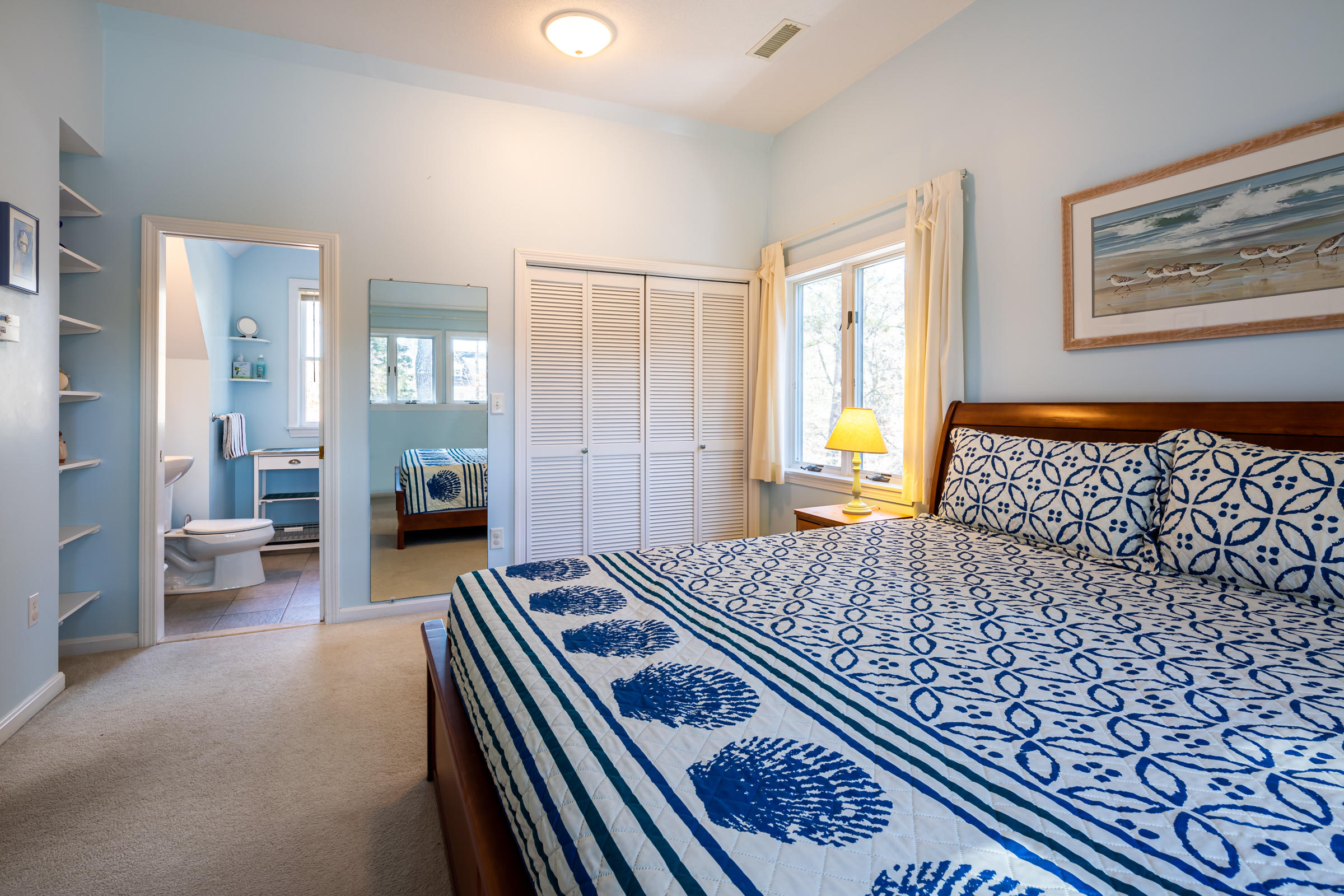 40 Chestnut Drive Orleans, MA 02653 - Photo 23 of 40 a bedroom with a bed and a couch