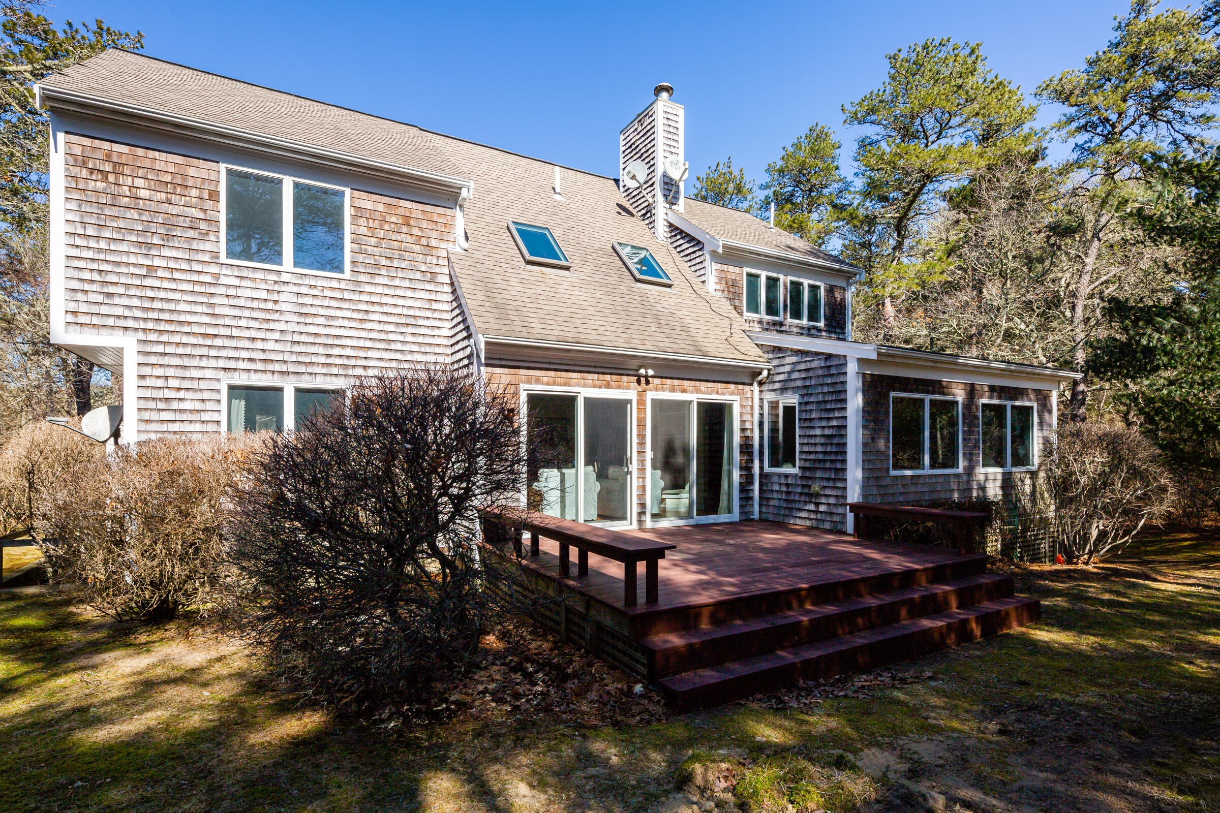 40 Chestnut Drive Orleans, MA 02653 - Photo 31 of 40 a view of a house with a yard and furniture