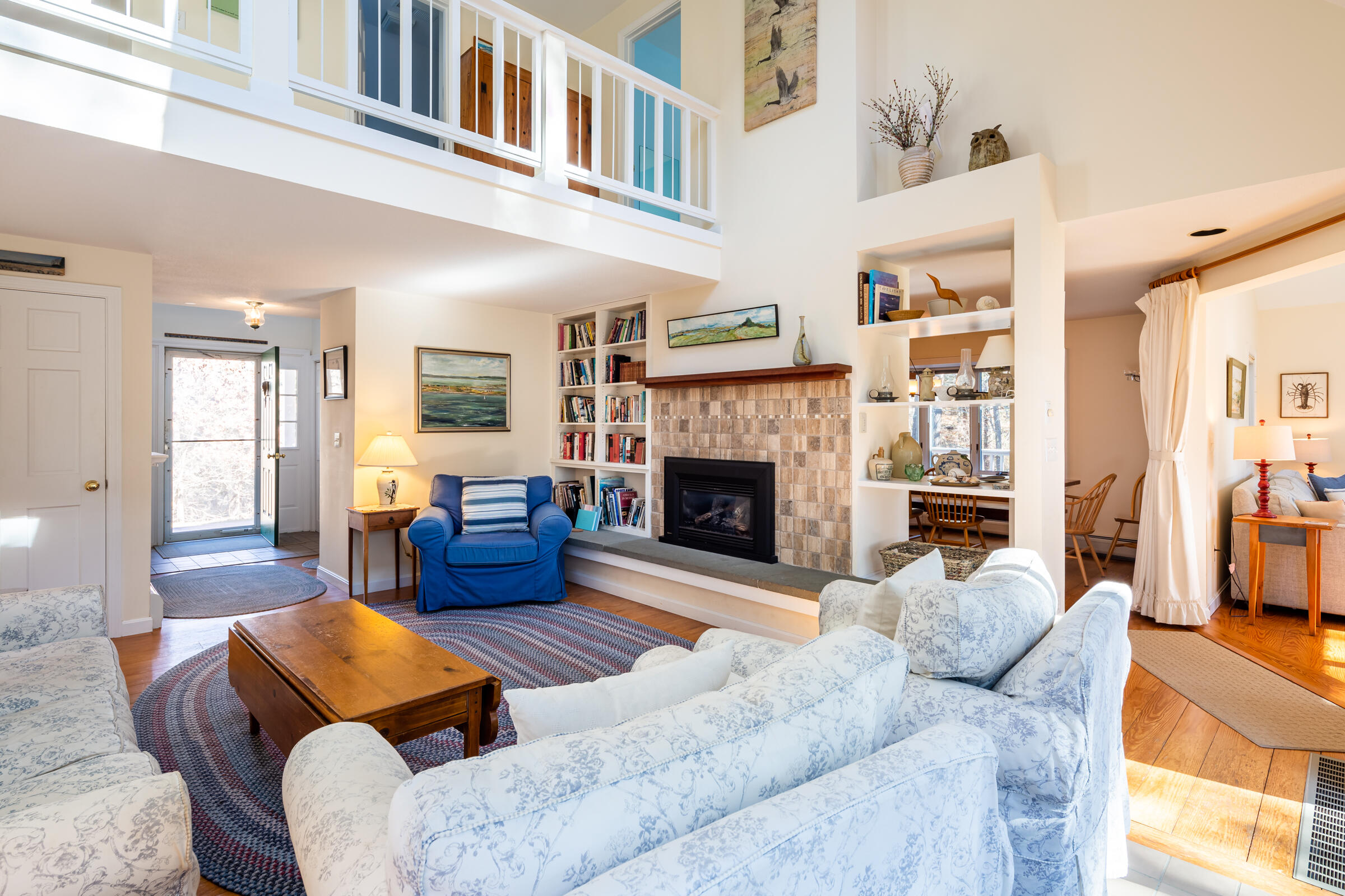 40 Chestnut Drive Orleans, MA 02653 - Photo 9 of 40 a living room with furniture fireplace and a table