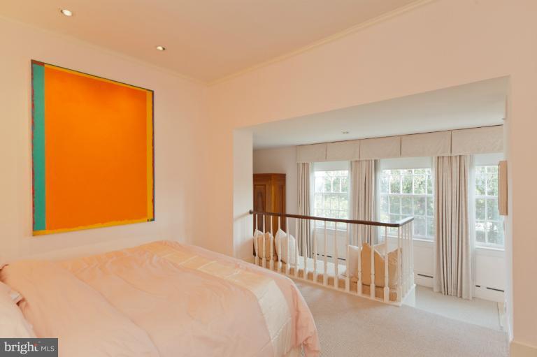 3122 N Street Northwest Washington, DC 20007 - Photo 11 of 19 a bedroom with a bed and a window