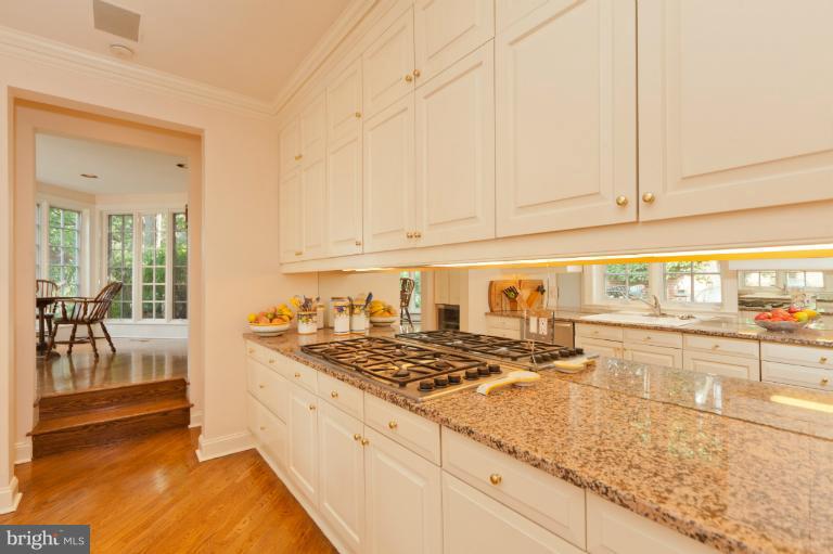 3122 N Street Northwest Washington, DC 20007 - Photo 14 of 19 a kitchen with stainless steel appliances granite countertop a sink stove and cabinets