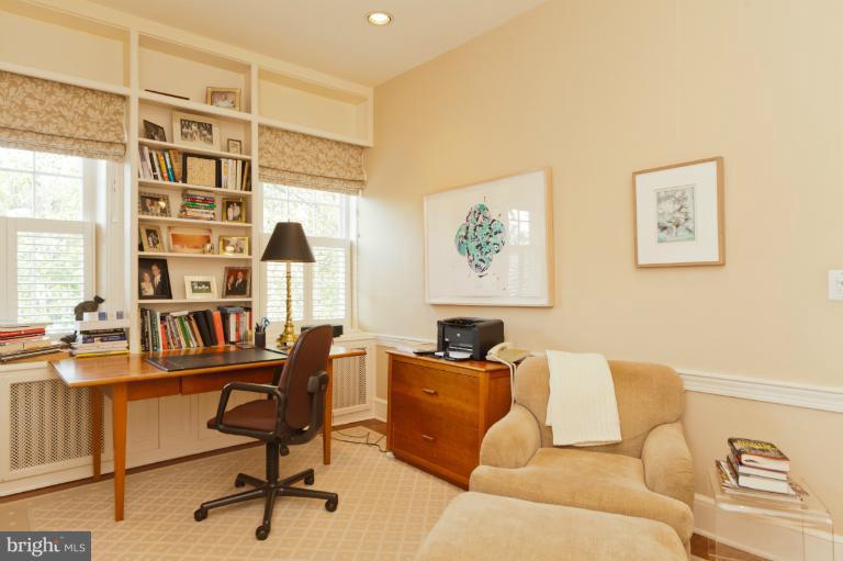 3122 N Street Northwest Washington, DC 20007 - Photo 7 of 19 a view of a livingroom with workspace and a couch