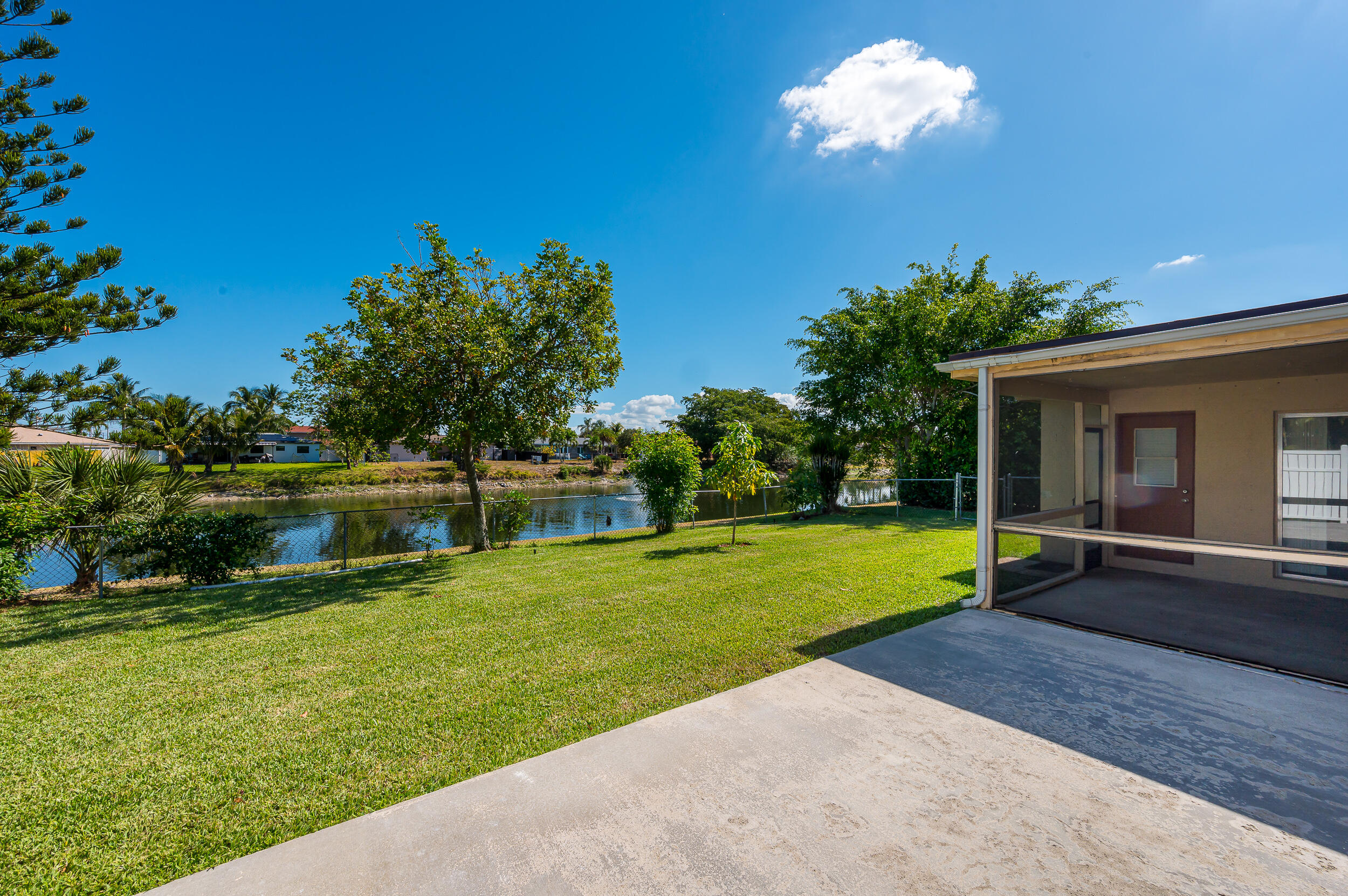 10905 Eureka Street Boca Raton, FL 33428 - Photo 12 of 16 a view of a house with a yard