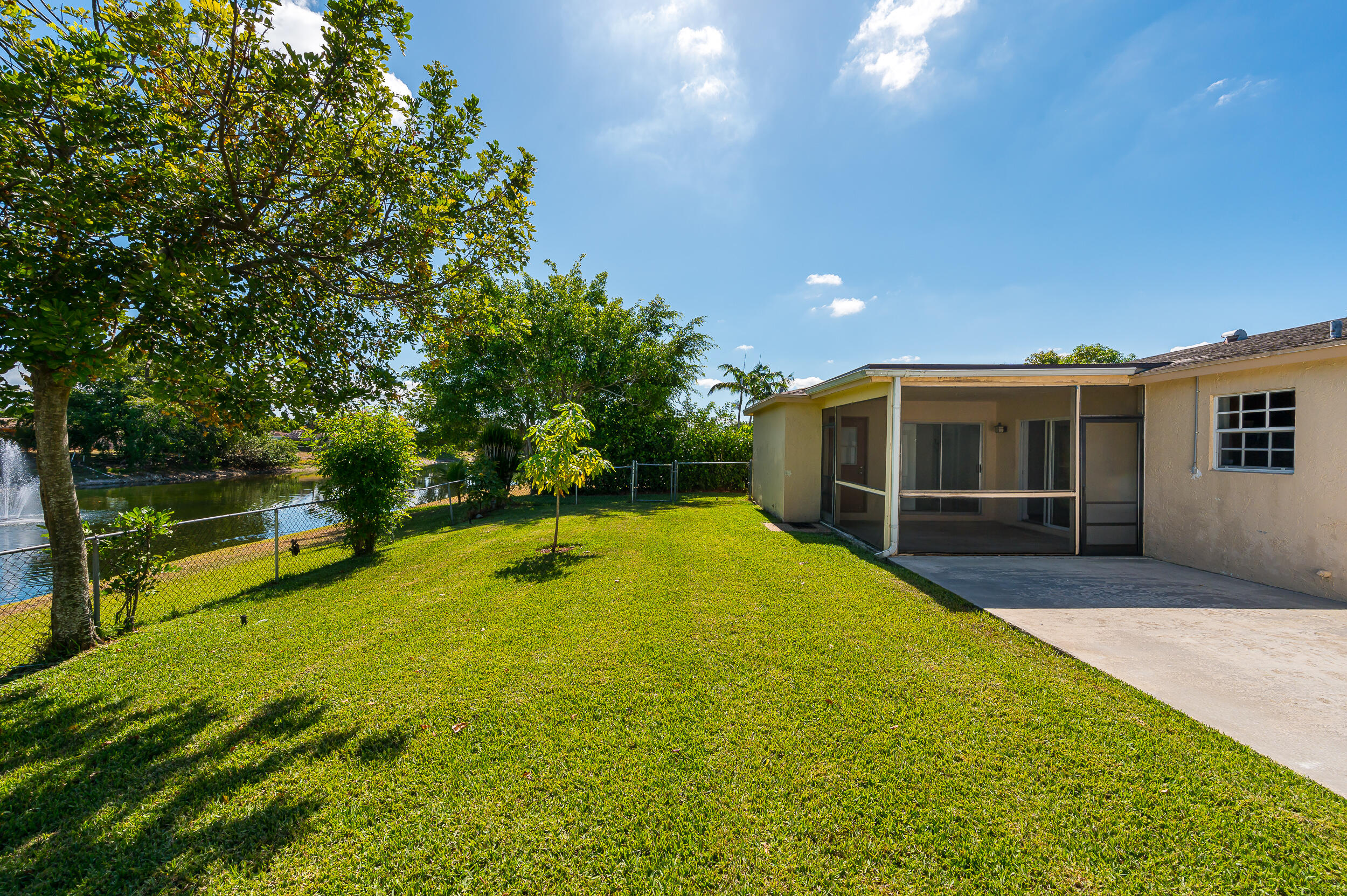 10905 Eureka Street Boca Raton, FL 33428 - Photo 13 of 16 a view of a house with swimming pool and sitting area