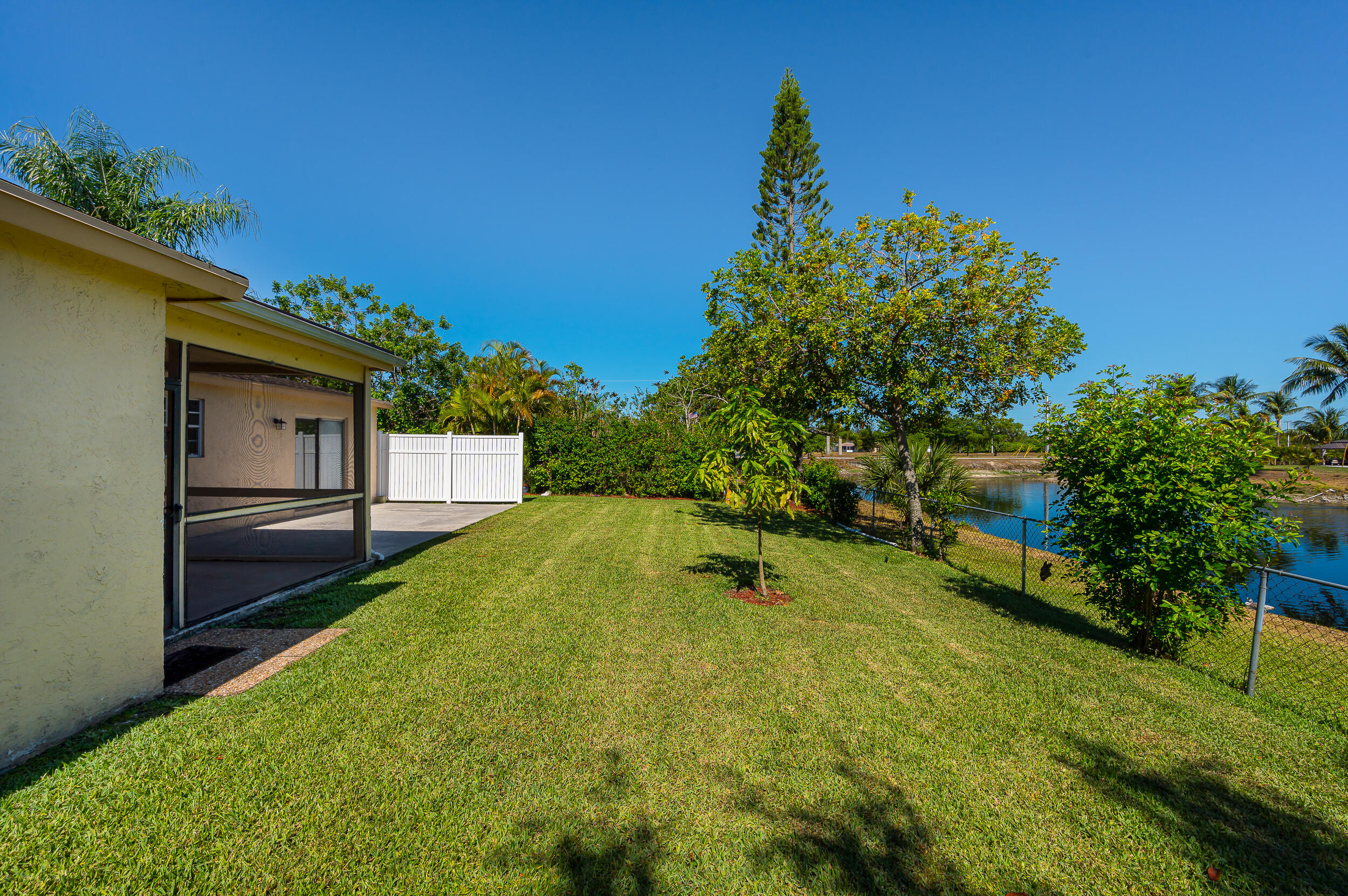 10905 Eureka Street Boca Raton, FL 33428 - Photo 14 of 16 a view of an outdoor space and a yard