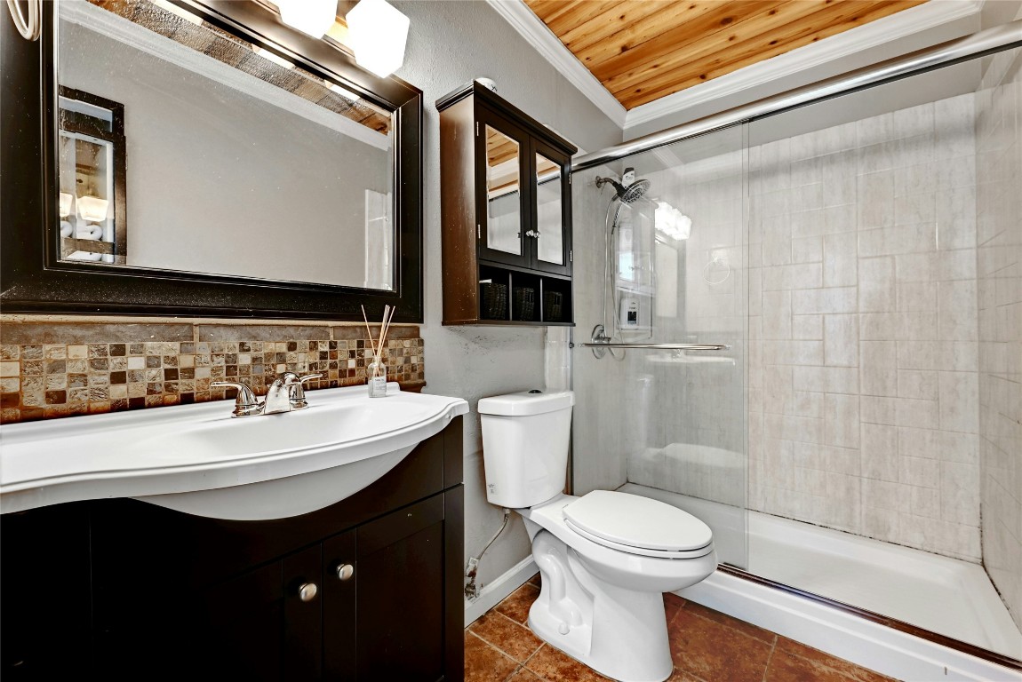 1304 Summit Street, Unit 101 Austin, TX 78741 - Photo 10 of 13 a bathroom with a sink toilet and shower