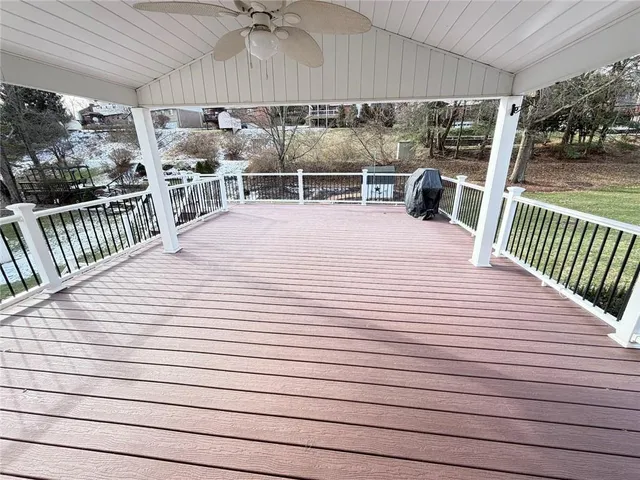 a view of a house with deck and wooden floor