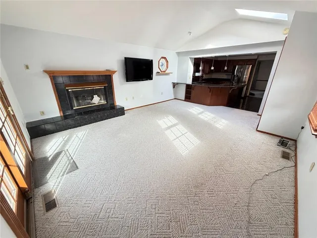 a bedroom with a bed and a television