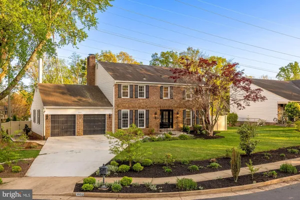 front view of a house with a garden
