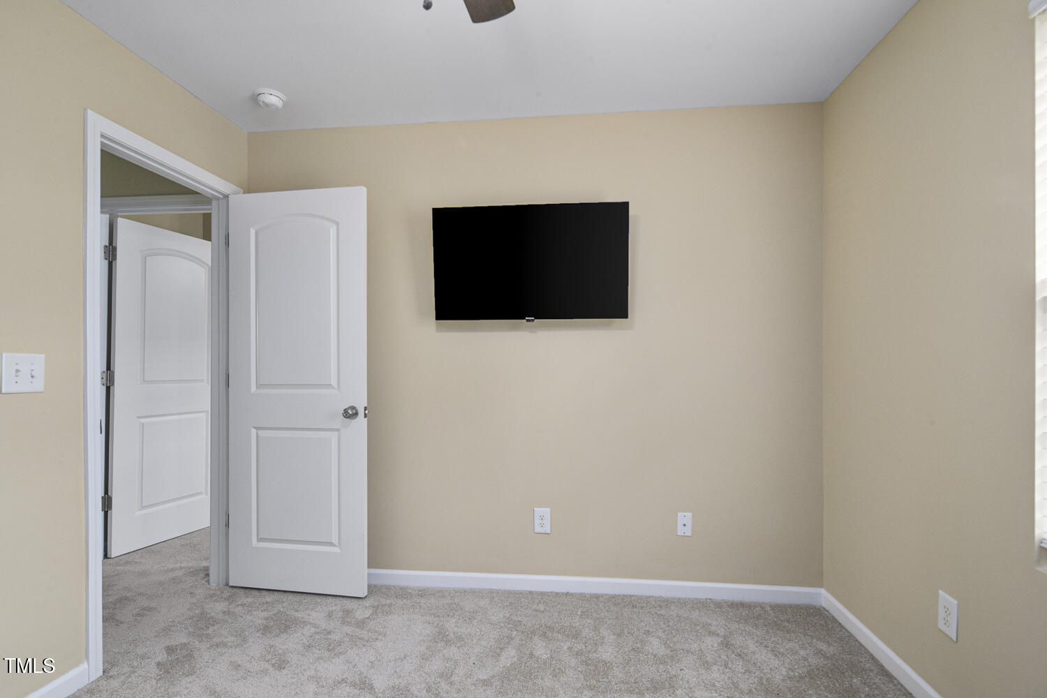 1536 Ricochet Drive Raleigh, NC 27610 - Photo 28 of 31 a view of a livingroom with a flat screen tv