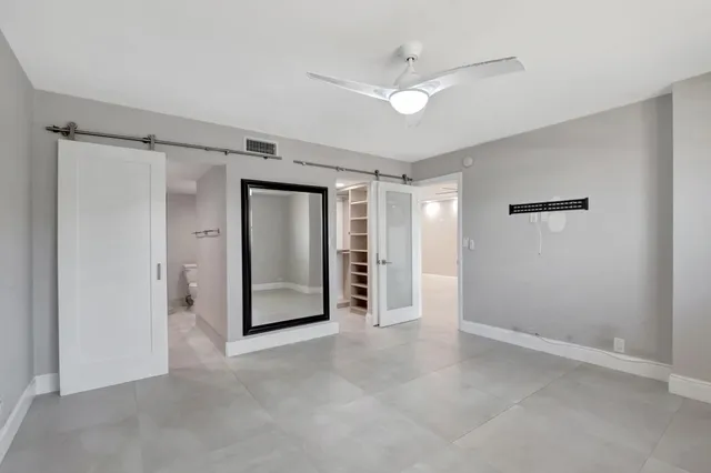 a bathroom with a double vanity sink mirror and shower