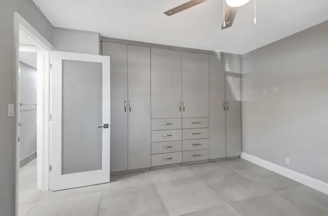 a view of a swimming pool with a table and chairs