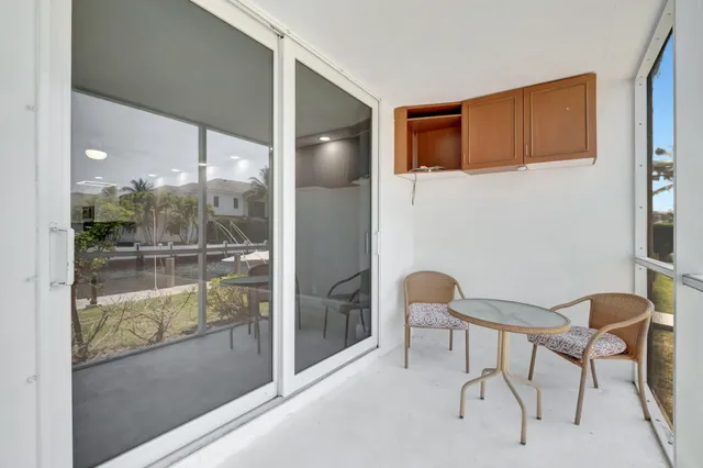 a park view with a bench and trees in the background