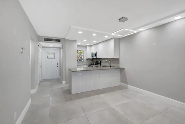 a view of a kitchen with a sink