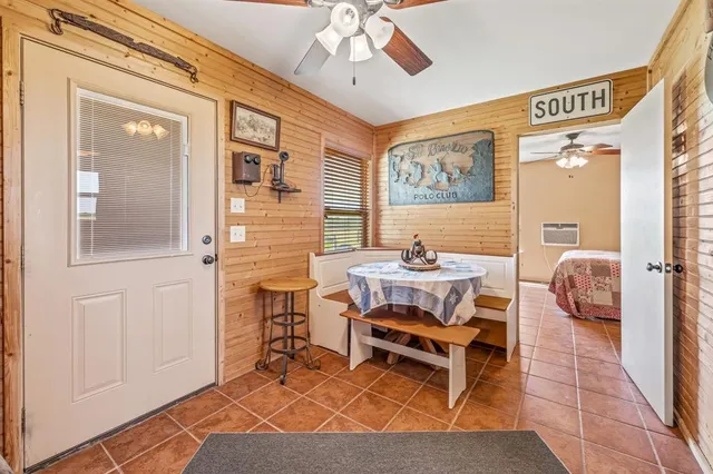 a balcony with furniture and a chandelier