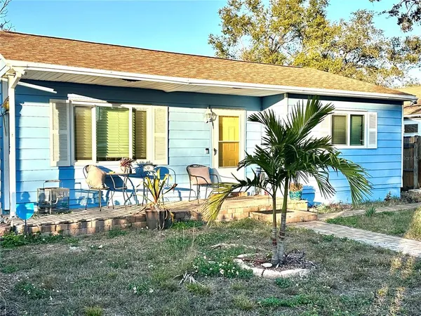 a view of a backyard with a patio