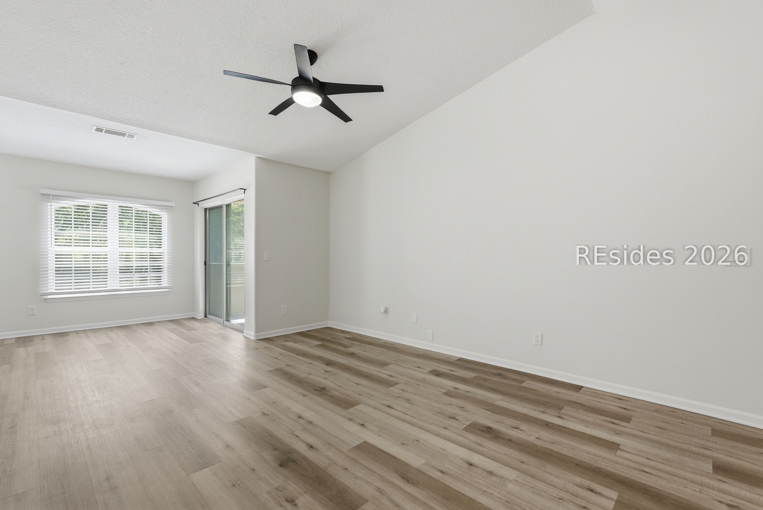 897 Fording Island Road, Unit 1303 Bluffton, SC 29910 - Photo 20 of 48 Large living area with access to covered patio.