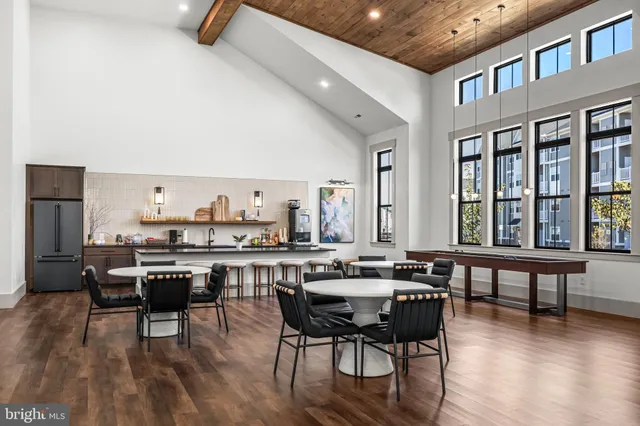 a view of a dining room with furniture wooden floor and chandelier