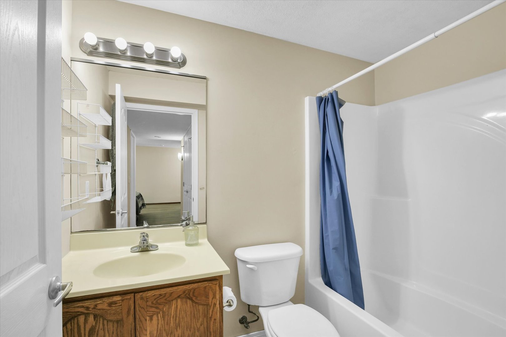 3715 Boulder Ridge Drive Champaign, IL 61822 - Photo 26 of 29 a bathroom with a sink toilet and shower