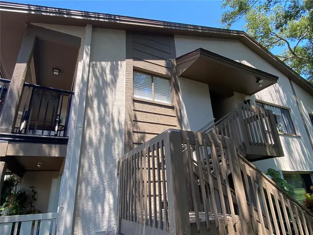 a front view of a house with a yard and a garage