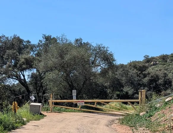 a view of park with trees in the background