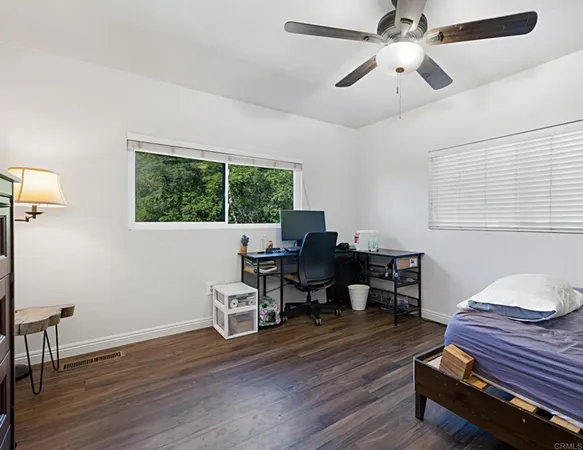 a view of a yard with large trees