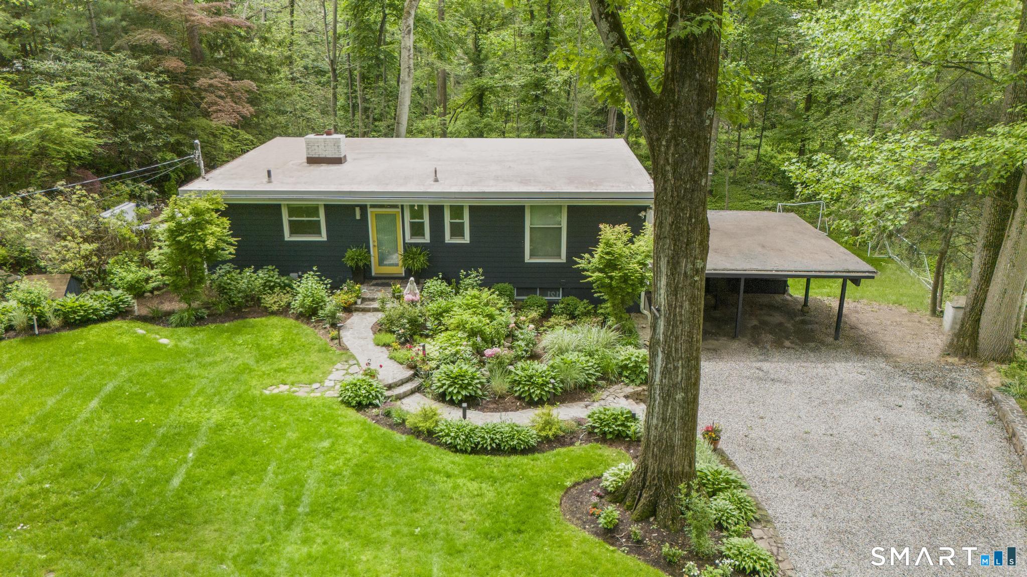 13 Alewives Road Norwalk, CT 06850 - Photo 1 of 40 Extensive outdoor lighting presents beautiful nightime atmosphere.