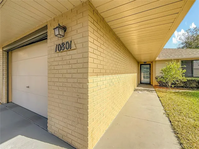 a view of a pathway along the house
