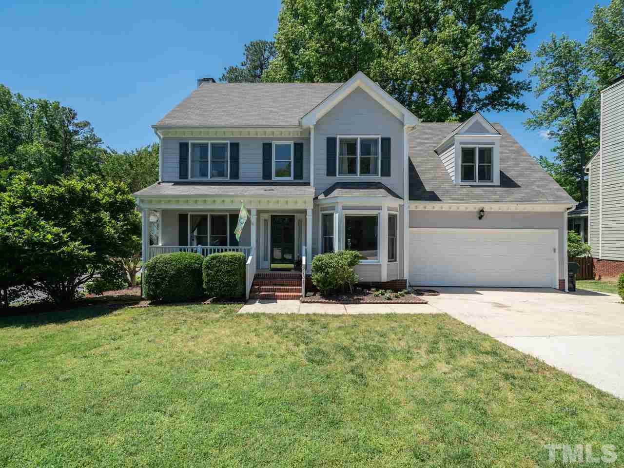 9101 Cub Trail Raleigh, NC 27615 - Photo 1 of 22 a front view of a house with a yard