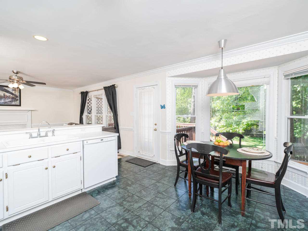 9101 Cub Trail Raleigh, NC 27615 - Photo 11 of 22 a view of a dining room with furniture and window