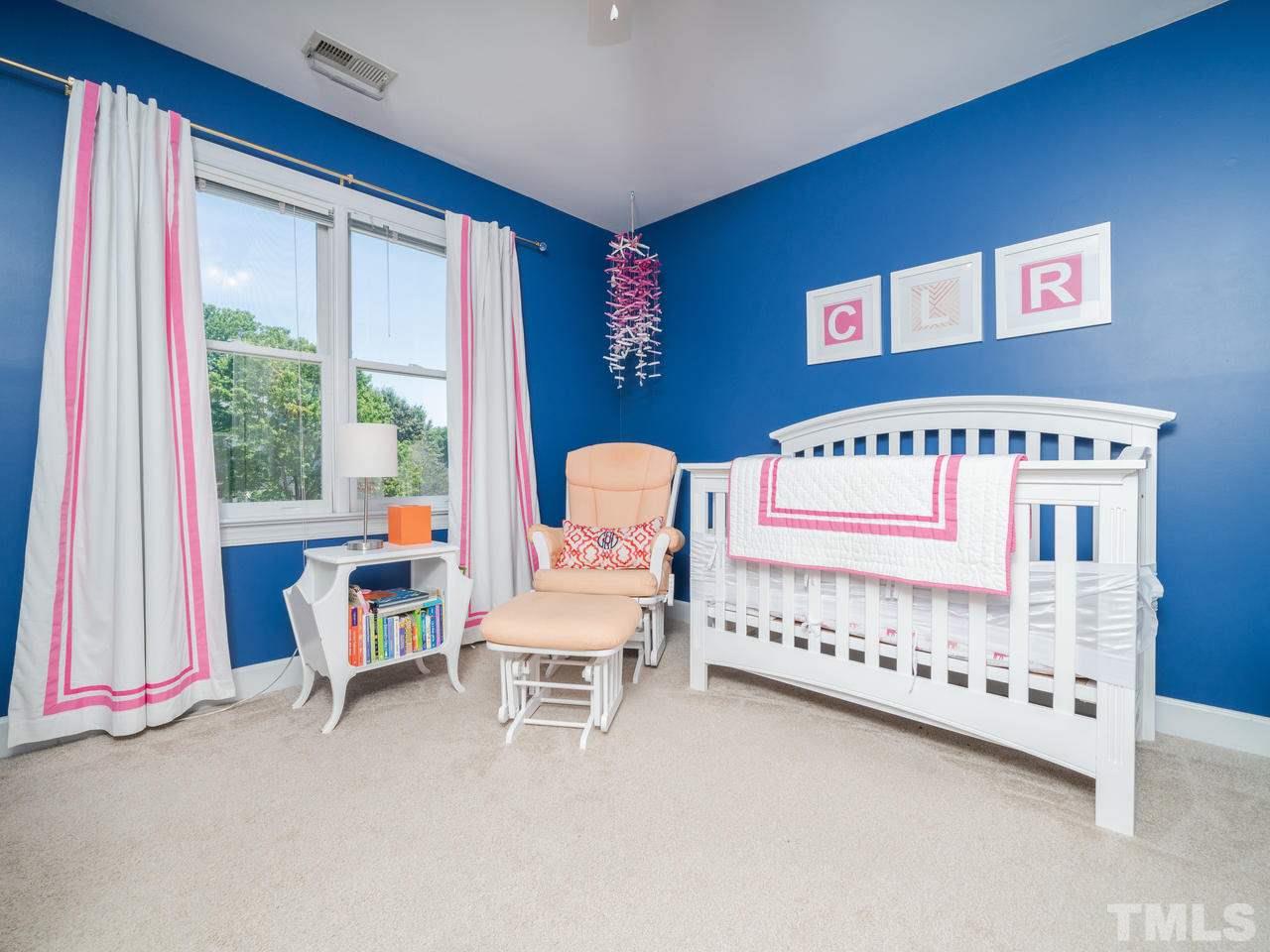 9101 Cub Trail Raleigh, NC 27615 - Photo 13 of 22 a bedroom with furniture and a window