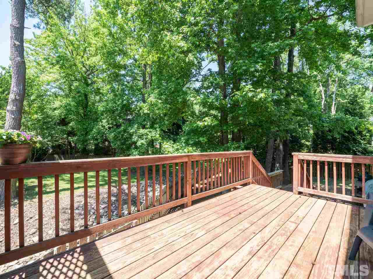 9101 Cub Trail Raleigh, NC 27615 - Photo 19 of 22 a view of balcony with wooden floor and fence