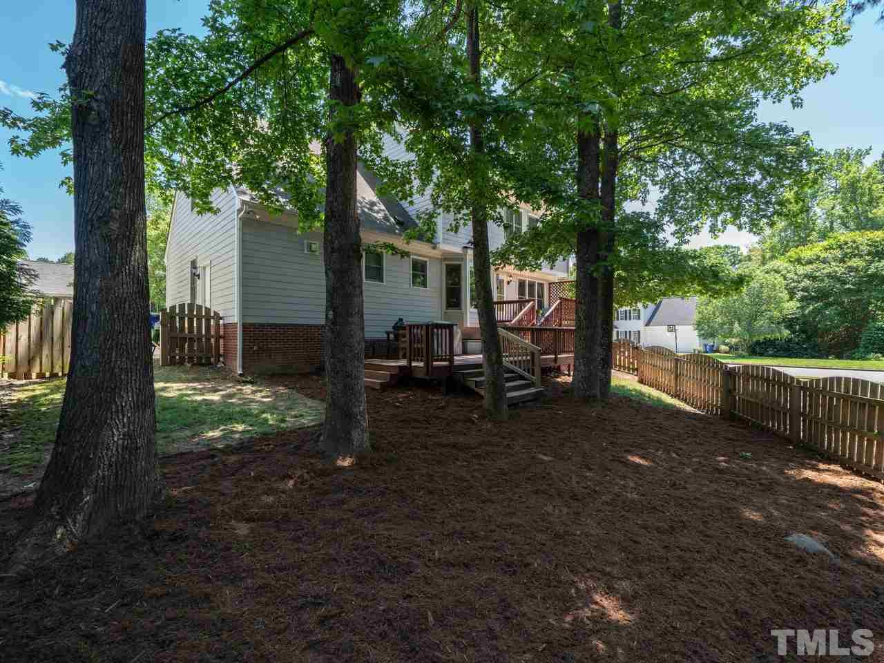 9101 Cub Trail Raleigh, NC 27615 - Photo 21 of 22 a backyard of a house with lots of green space