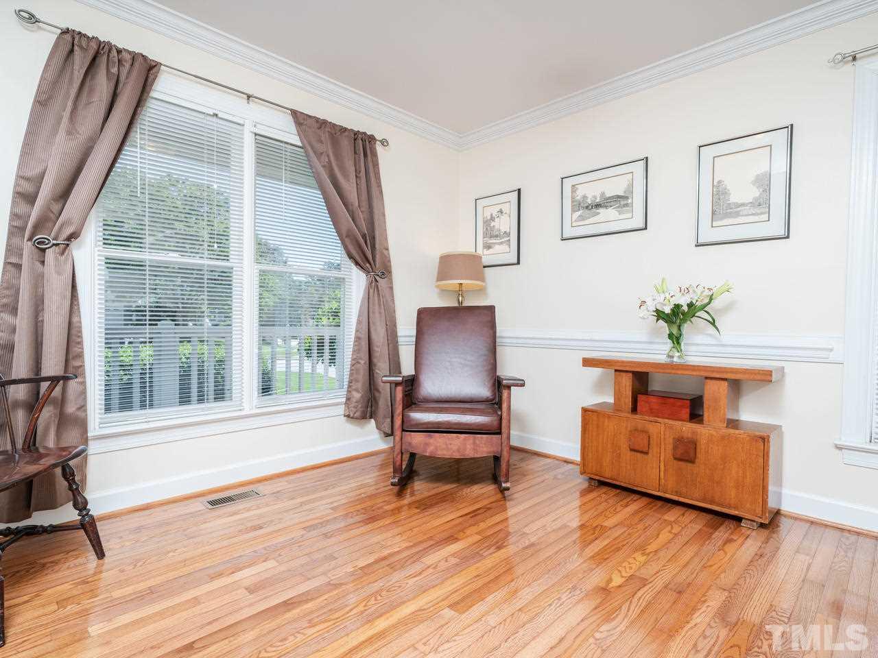 9101 Cub Trail Raleigh, NC 27615 - Photo 5 of 22 a living room with furniture and a wooden floor
